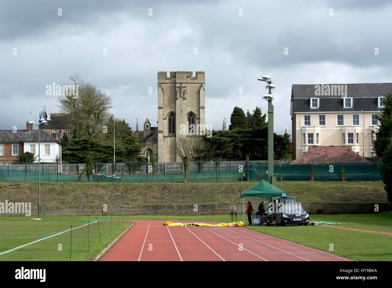 Iffley Road running track with St. John`s Church behind, Oxford, UK